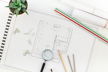 Interior designer table workplace with house plan