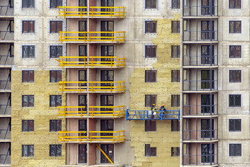 Facade work and insulation of a multistory building