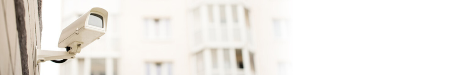 Surveillance camera on wall