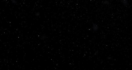 Natural white winter snowfall on a black background