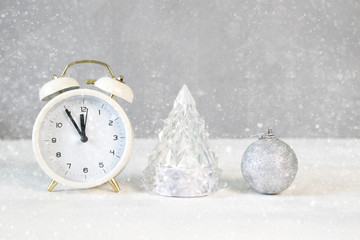 Fototapeta na wymiar Christmas holiday minimal concept with gift box, clock and christmas tree
