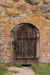 Ancient door in medieval fortress. Korela Fortress, Russia