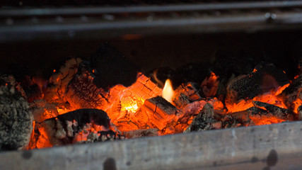 Hot coals under the grill grate