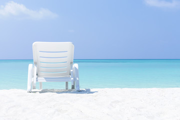 Sun bed on sandy beach