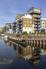 Fototapeta na wymiar Boats at Limehouse Basin Marina, near Canary wharf riverside, London city, UK