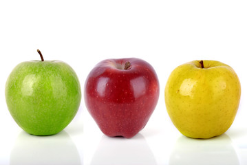 Yellow, red and green apple on white isolate.