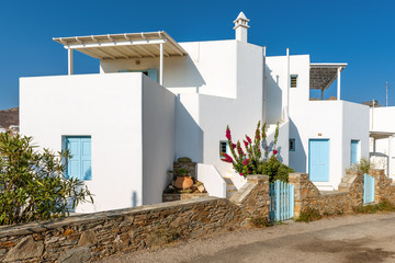 Beautiful cycladic architecture with whitewashed walls and blue doors in summer day. Serifos island, Greece © vivoo