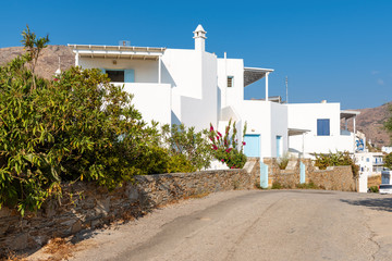 Typical street with whitewashed houses in Livadi village on Serifos island, Greece © vivoo