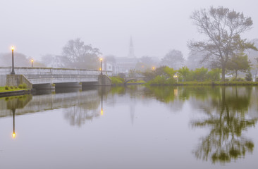 Foggy autumn morning at Asbury Park, New Jersey featuring dreamy view of the lake 