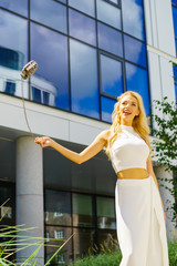 Cheerful fashionable woman in city