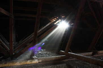 Ray of light in the dark attic of the abandoned manor