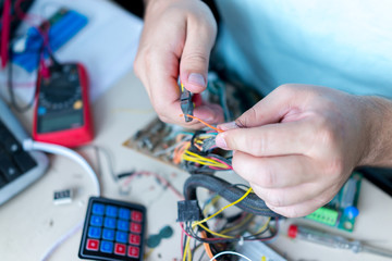 Man fixing electronics