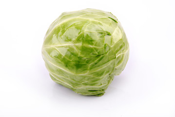 Young cabbage on a white background.