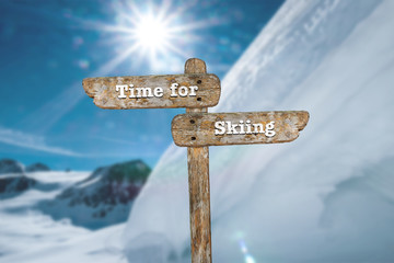 Time for skiing. Information sign and blurred background.