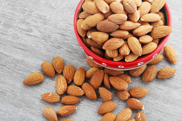 A ceramic bowl full of almonds