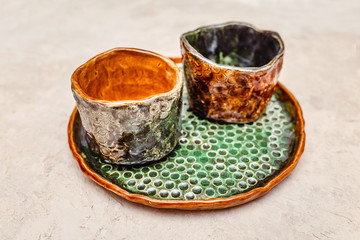 Handmade decorative ceramic dishes as pottery concept