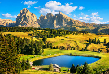 Lake and mountains, Alpe di Siusi or Seiser Alm, Dolomites Alps, Italy. - obrazy, fototapety, plakaty