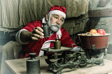 Santa weighing Nuts & Apples