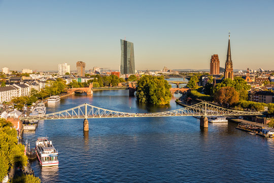 Frankfurt am Main - "Eiserner Steg" bridge  crossing the river Main - the new building of European Central Bank in the background 