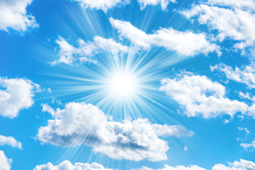 Sun and clouds on blue sky as nature background