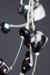 handmade jewelry made of beads in macro. necklaces from black beads. necklaces from stones