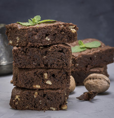 stack of baked square pieces of brownie pie