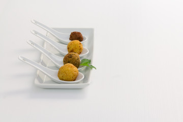 Fried meat balls in a white plate on white background with copy space