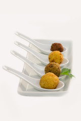 Fried meat balls in a white plate on white background with copy space, Apulia, Salento, Italy, vertical