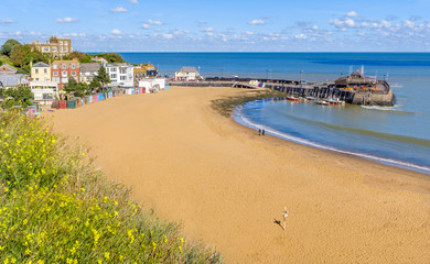 Golden sand of Viking Bay Broadstairs, Thanet, Kent, UK and the historic Bleak House on a sunny...