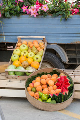 fruits in a box for sale on the street near a truck, Italy, Apulia, Salento