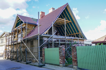 complete reconstruction of old wooden house in city