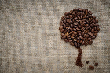 Coffee tree made of coffee beans on burlap rustic rough simple beautiful.