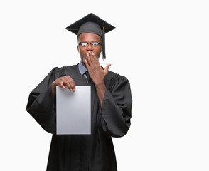 Young graduated african american man holding blank paper degree over isolated background cover mouth with hand shocked with shame for mistake, expression of fear, scared in silence, secret concept