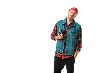confident male photographer in denim vest and checkered shirt holding camera isolated on white