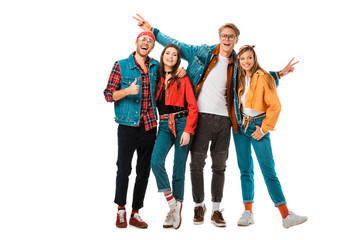happy hipster men showing peace signs and thumb up while their female friends standing near isolated on white