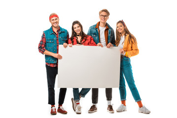 cheerful stylish hipster friends holding blank banner isolated on white