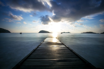 sunset scenery at Redang Island,Malaysia . soft focus,blur due to long exposure. visible noise due to high ISO.
