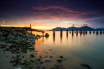 Obraz premium Sunset Scenery at Marina Islands Jetty,Perak,Malaysia With Clear Water.Soft Focus,Blur due to Long Exposure.