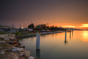 Sunset Scenery at Marina Islands Jetty,Perak,Malaysia With Clear Water.Soft Focus,Blur due to Long Exposure.