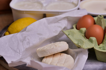 Fresh products from the farmer market - eggs, lemon, goat cheese and cottage cheese.