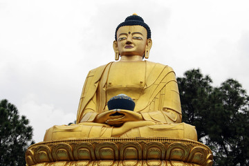 The golden Buddha statues and stupa at Amideva Park on the foothill of Swayambhunath