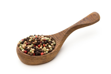 Pepper mix seed on spoon on white background.
