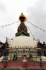 One quiet stupa (and its eyes) in the middle of Kathmandu local market.