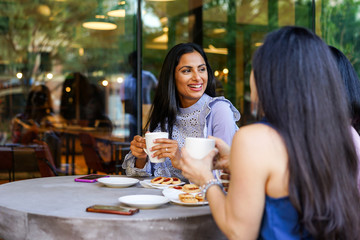 Businesswomen relaxing in cafe