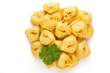 Raw homemade pasta,tortellini with herbs.