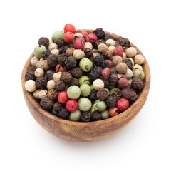 Pepper mix seed on spoon on white background.