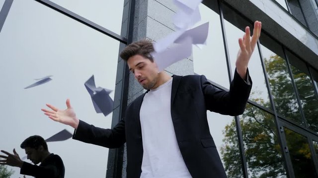 Angry furious male office worker throwing crumpled paper, having nervous breakdown at work, screaming in anger, stress management, mental distress problems, losing temper, reaction on failure.
