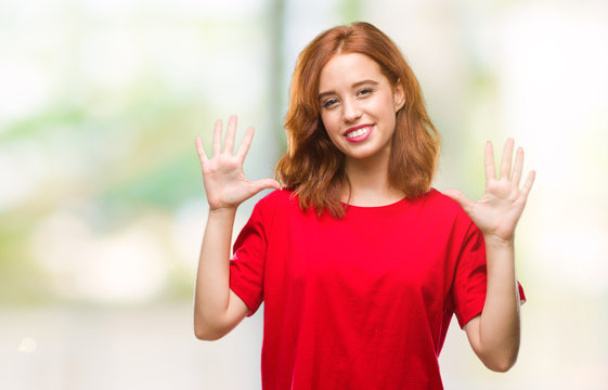 Young beautiful woman over isolated background showing and pointing up with fingers number ten while smiling confident and happy.