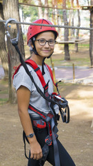 Naklejka premium Girl in mountaineering training. She's very happy.
