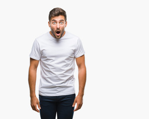 Fototapeta premium Young handsome man over isolated background afraid and shocked with surprise expression, fear and excited face.